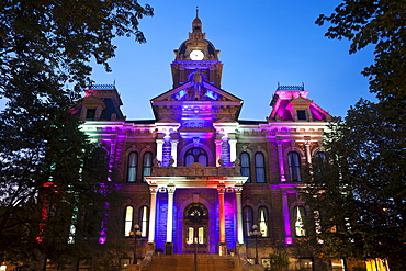 USA, Ohio, Cambridge, Town hall with colorful lights at dusk