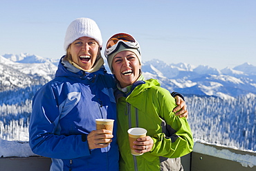 USA, Montana, Whitefish, Portrait of two women with mountains as backdrop