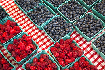 Raspberries and blueberries in cartons