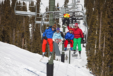 USA, Colorado, Telluride, Family on ski lift