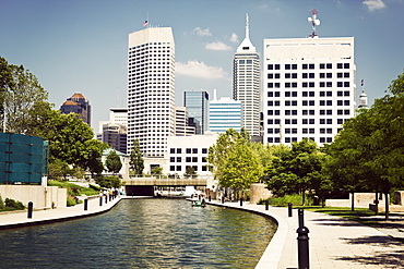 USA, Indiana, Indianapolis, View of canal and skyscrapers