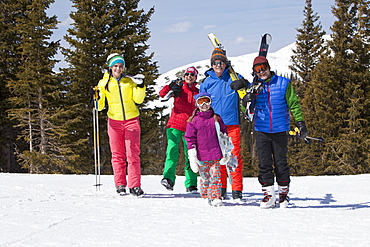 USA, Colorado, Telluride, Three-generation family with girl (10-11) posing during ski holiday