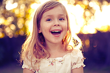 Portrait of girl (4-5) laughing