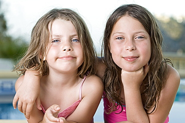 Spain, Costa Blanca, Two girls (6-7,8-9) embracing