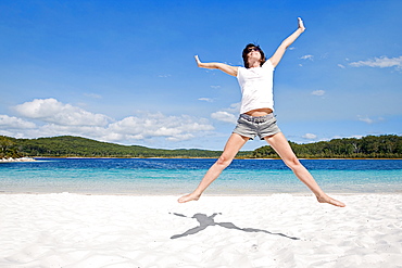 Fraser Island, Australia, Woman cheering on beach