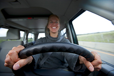 USA, California, Mid adult woman driving