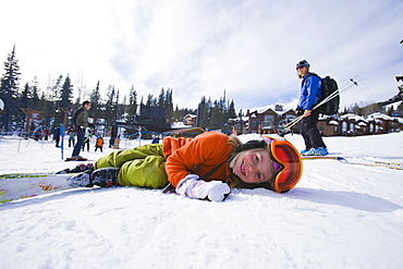 USA, Montana, Whitefish, Girl (8-9) skiing with her mother