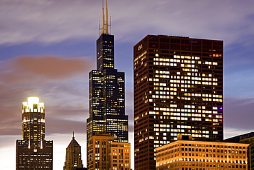 USA, Illinois, Chicago, Illuminated skyscrapers at dusk