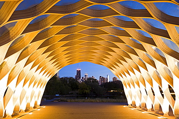 USA, Illinois, Chicago, Illuminated tunnel with city skyline in distance, dusk