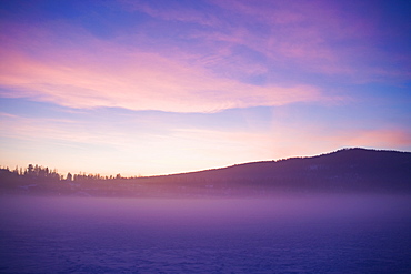 USA, Montana, Whitefish, Snow covered landscape at sunset