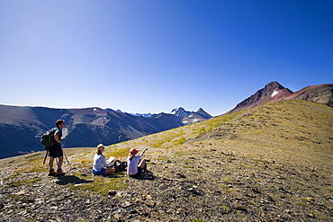 USA, Montana, Glacier National Park, Hikers resting on top
