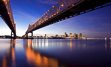 USA, Louisiana, New Orleans, Toll bridge over Mississippi River at sunset