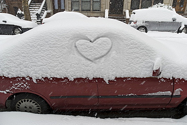 Heart shape in snow on car