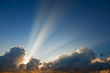 Sunset behind clouds