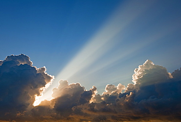 Sunset behind clouds