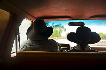 Cowboy and cowgirl in truck