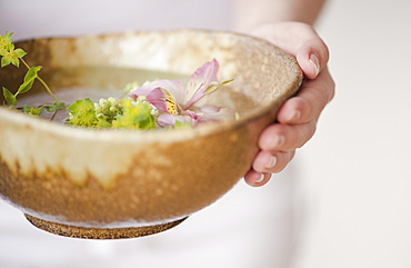 Woman holding aromatherapy bowl