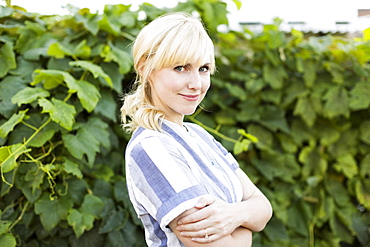 Portrait of blond woman in back yard