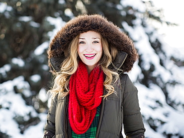 Portrait of woman wearing red scarf smiling outdoors, Salt Lake City, Utah