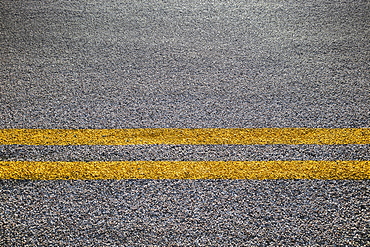 Close-up of double yellow line on road