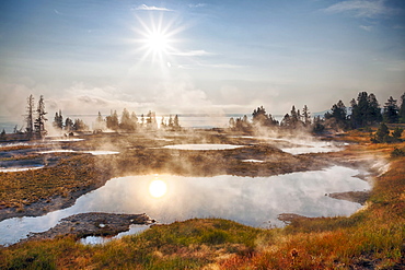 West Thumb Geyser Basin, Sun reflecting in water, West Thumb Geyser Basin, Yellowstone National Park, Wyoming