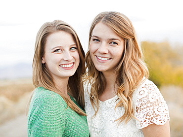 Portrait of two young women cheek to cheek, Provo, Utah