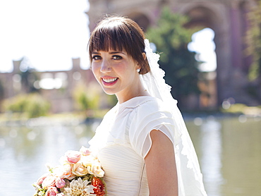 Portrait of young bride in park, San Francisco, California