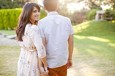 Couple walking in park, Salt Lake City, Utah