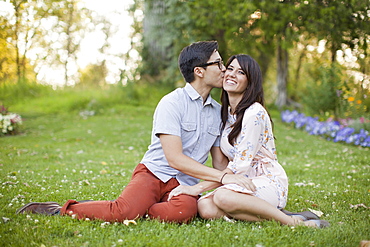 Couple relaxing in park, Salt Lake City, Utah