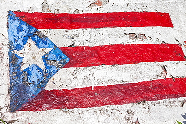 The Flag of Puerto Rico painted on a rock, Lucia Beach, Puerto Rico