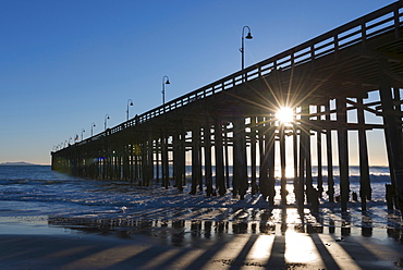 Sun shining through jetty, Ventura California