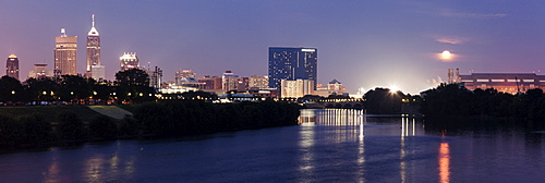 Moon rising over city, USA, Indiana, Indianapolis