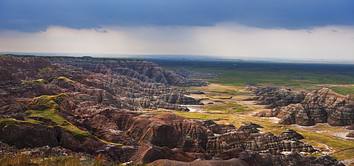 USA, South Dakota, Thick gray clouds over mountains in Badlands National Park