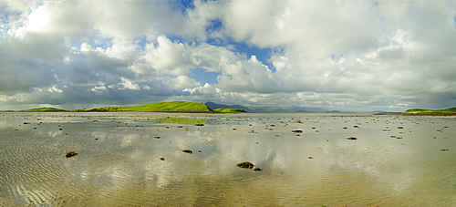 Panoramic landscape with water, clouds and hill on horizon, Clew Bay, County Mayo, Ireland