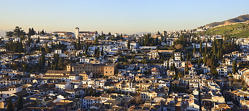 Townscape and hill in sunlight, Albayzin, Granada, Spain 