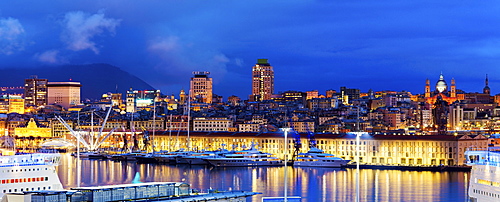 Italy, Liguria, Genoa, Panorama of harbor at dusk