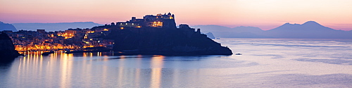 Italy, Campania, Panorama of Procida Island with Mt Vesuvius at sunrise