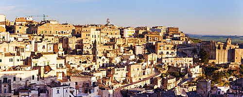 Italy, Basilicata, Matera, Panorama of old town at sunset