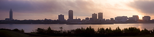 USA, Louisiana, Baton Rouge, City skyline over Mississippi River at sunrise