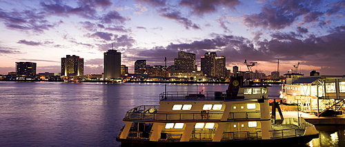 USA, Louisiana, New Orleans, Ferry on Mississippi River with city skyline