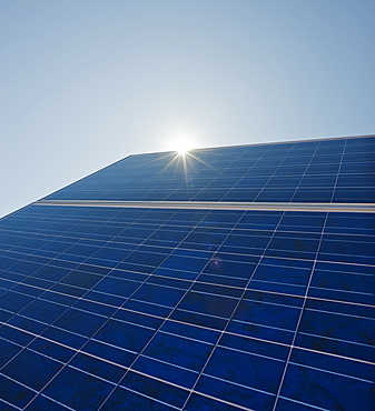 Sun shining on solar panel