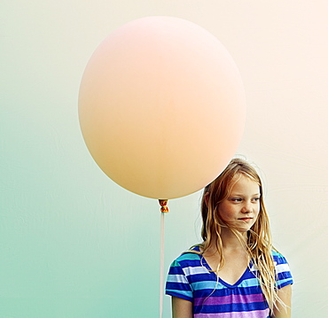 Texas, Austin, Blonde girl holding big balloon