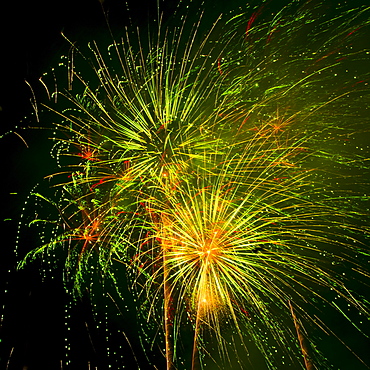 Fireworks explosion against night sky