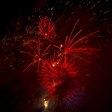 Fireworks explosion against night sky