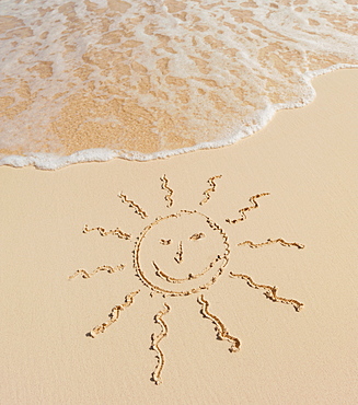 Sun drawing on beach