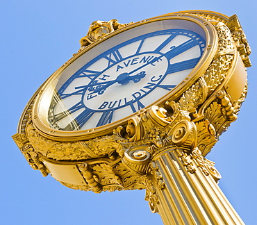 Antique clock against clear sky