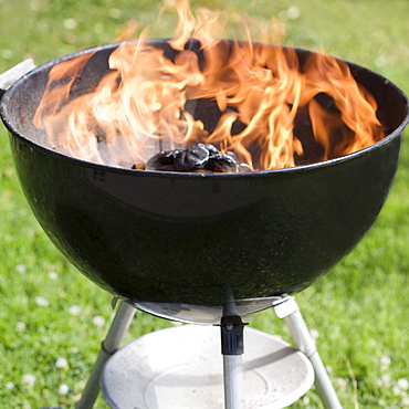 Charcoal burning in a grill