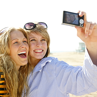 Two young women taking self-portrait