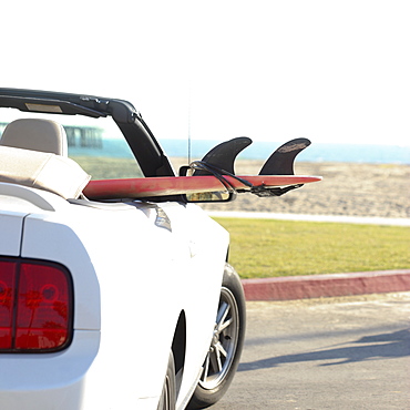 Surfboard in convertible car