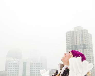 Jersey City, New Jersey, woman looking at bright sky